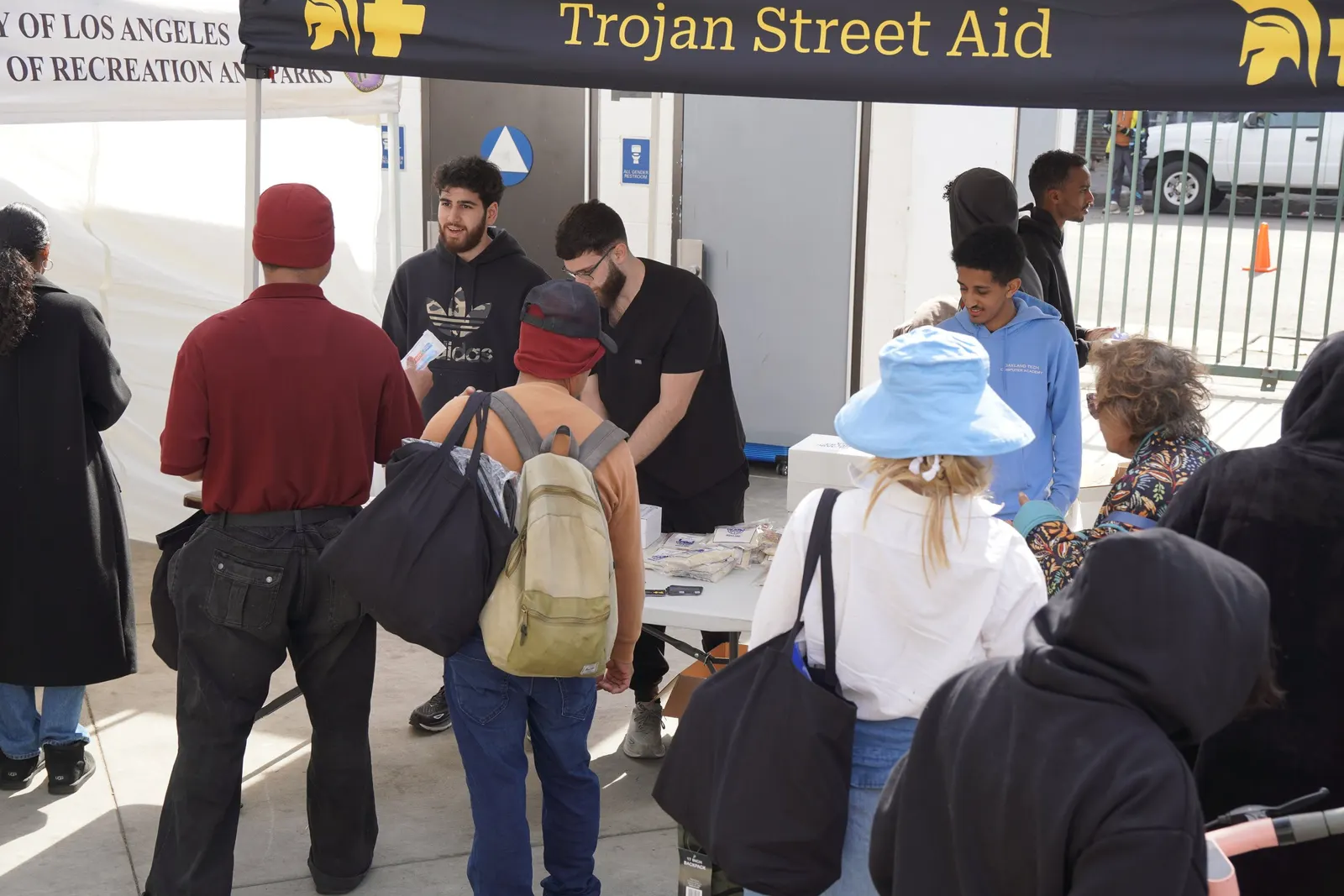 Volunteers handing out health kits and meals