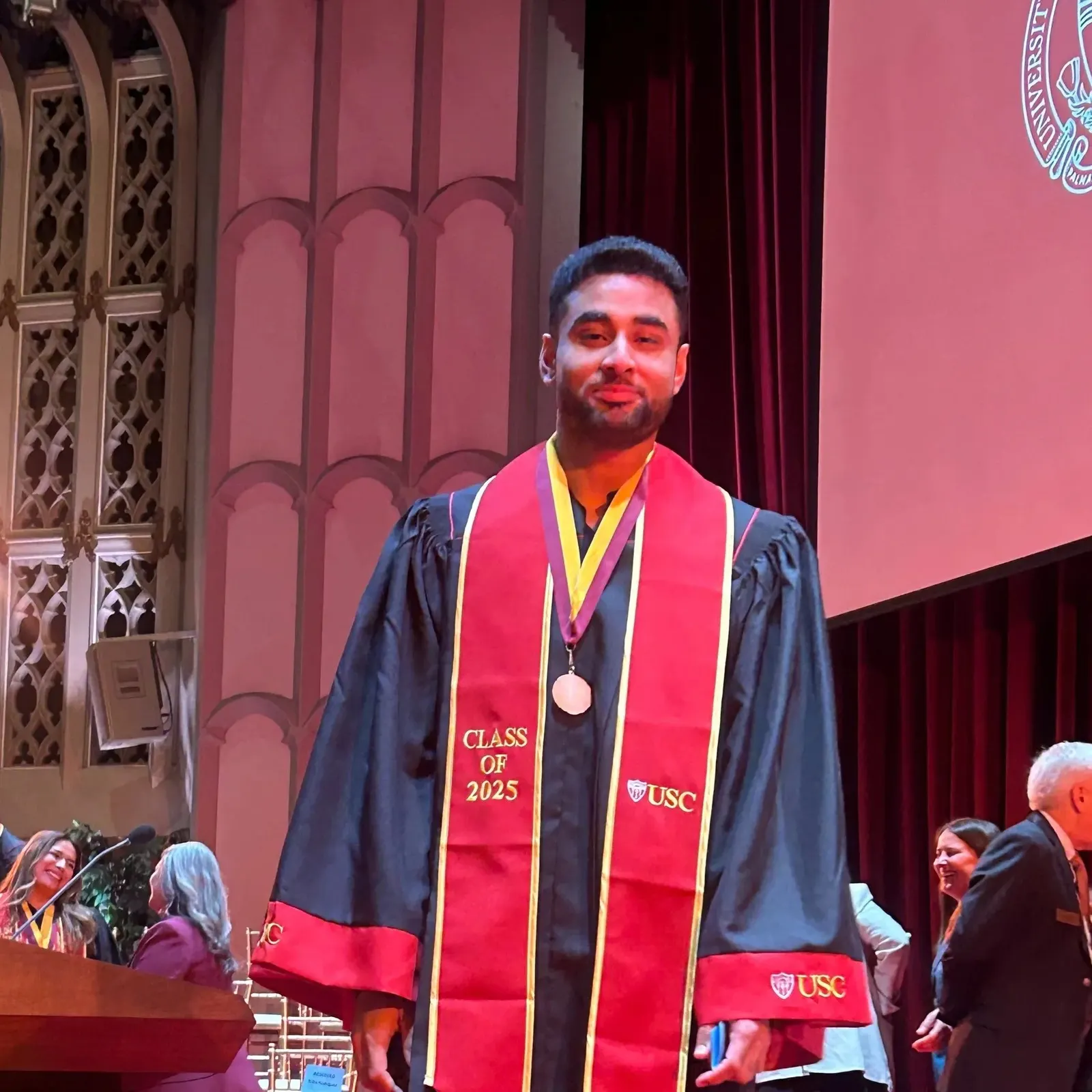 Talha Rafique at the Order of the Laurel and the Palm ceremony